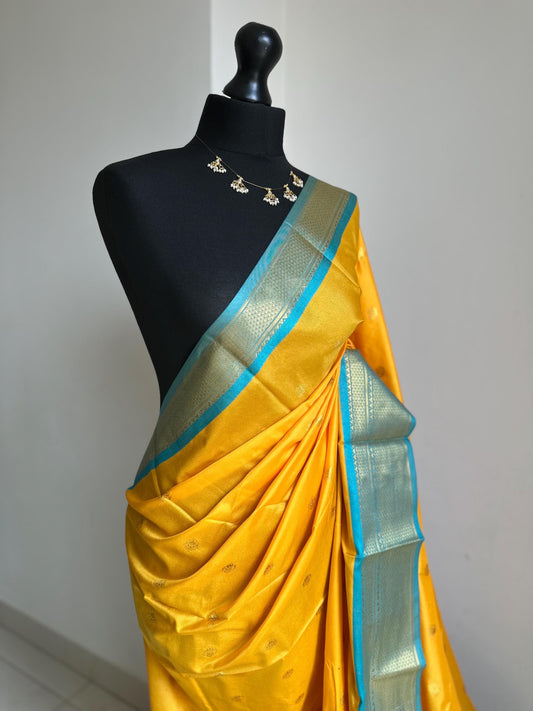 Blue and yellow semi silk saree with gold zari border and buti. Traditional designer saree beautiful colour and design.