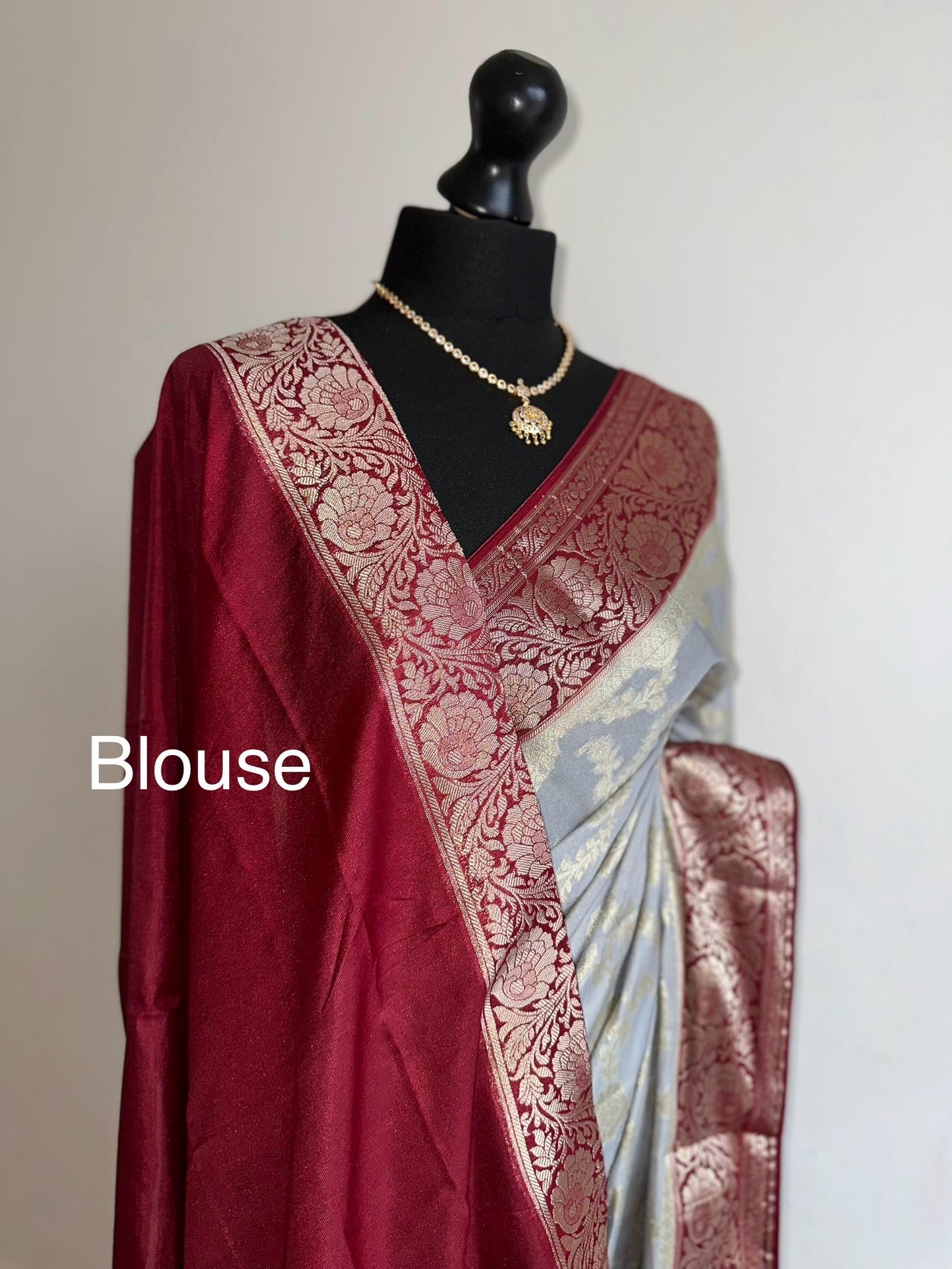Grey and maroon Banarasi Georgette Silk Saree with all over jaal design. Statement yet elegant saree thats soft to drape and pleat.