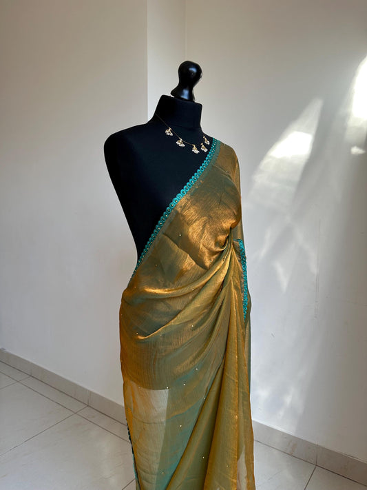 Dual toned olive green party saree with green trim border and contrast printed blouse. Unique statement saree can styled with other blouses