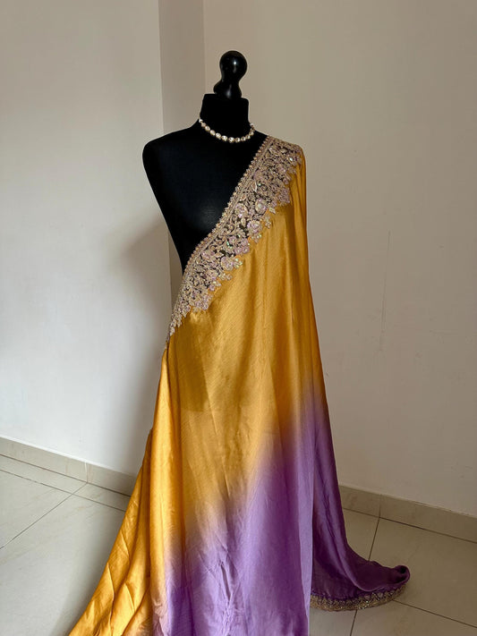 Shaded chiffon party wear Saree with stunning sequin stone embellished border. Lilac purple and mango orange soft lustre saree for occasion