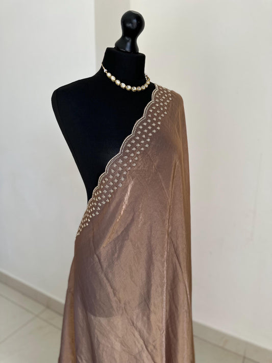 Copper brown party saree with embellished scalloped border. Soft chiffon versatile saree thats perfect for parties and evening events.