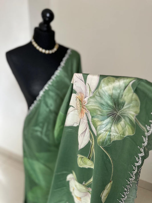Green floral party saree with embellished scalloped border. Soft satin versatile saree thats perfect for parties and evening events.