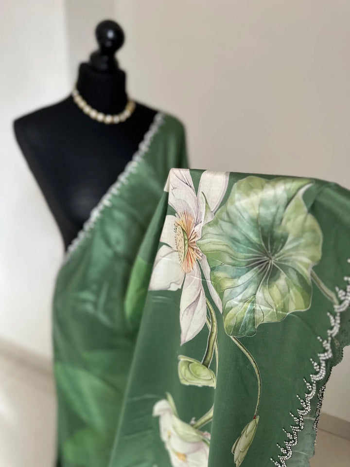Green floral party saree with embellished scalloped border. Soft satin versatile saree thats perfect for parties and evening events. LaiLai Sarees