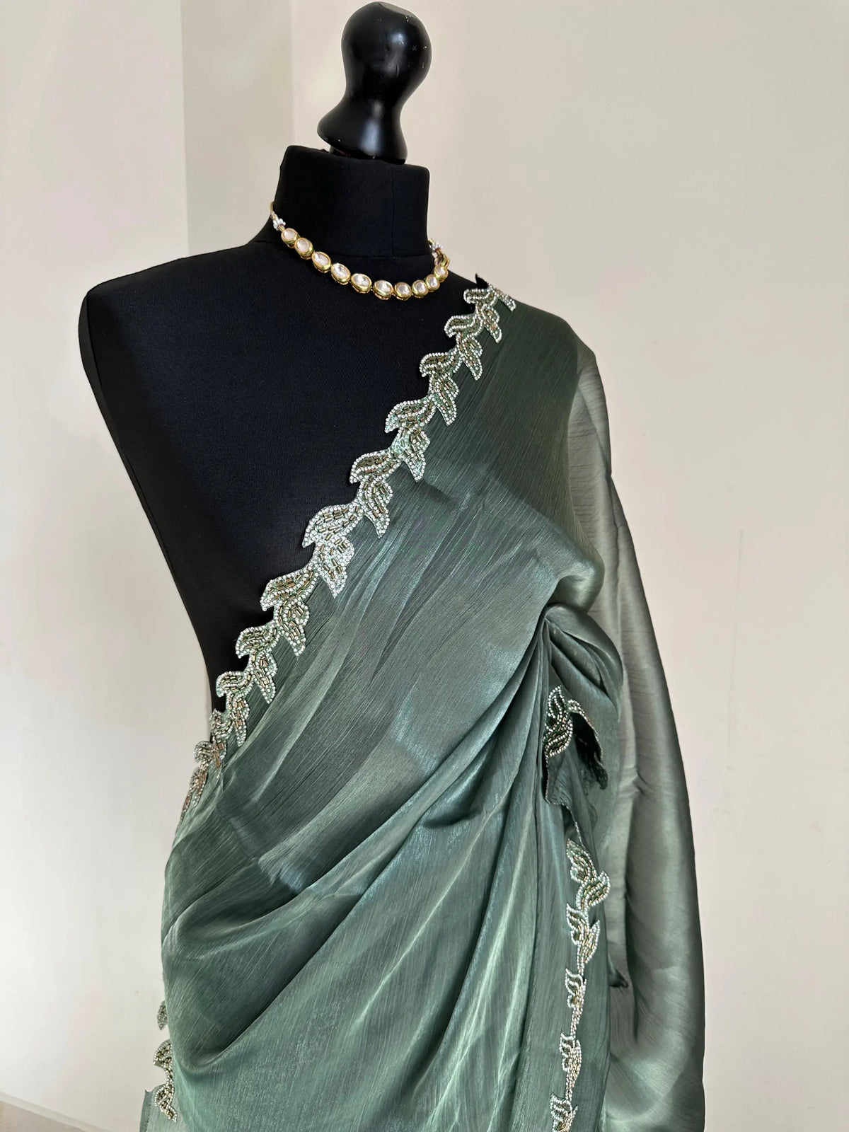Teal Green Chiffon Saree with Embellished Leaf Border