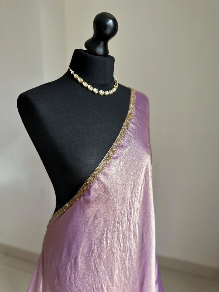 Lilac chiffon saree with cutdana border. Crafted from soft shimmer chiffon this saree is perfect for parties and evening occasions LaiLai Sarees