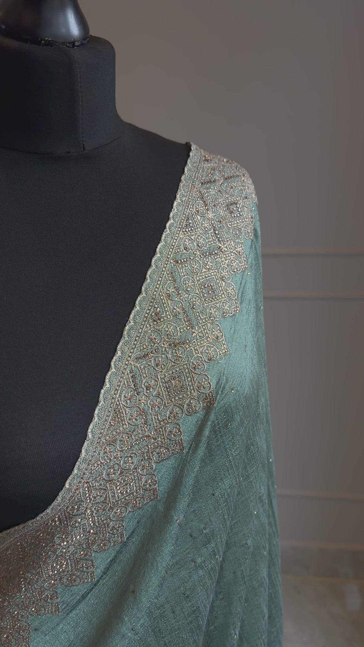 Teal georgette saree with antique gold stonework border